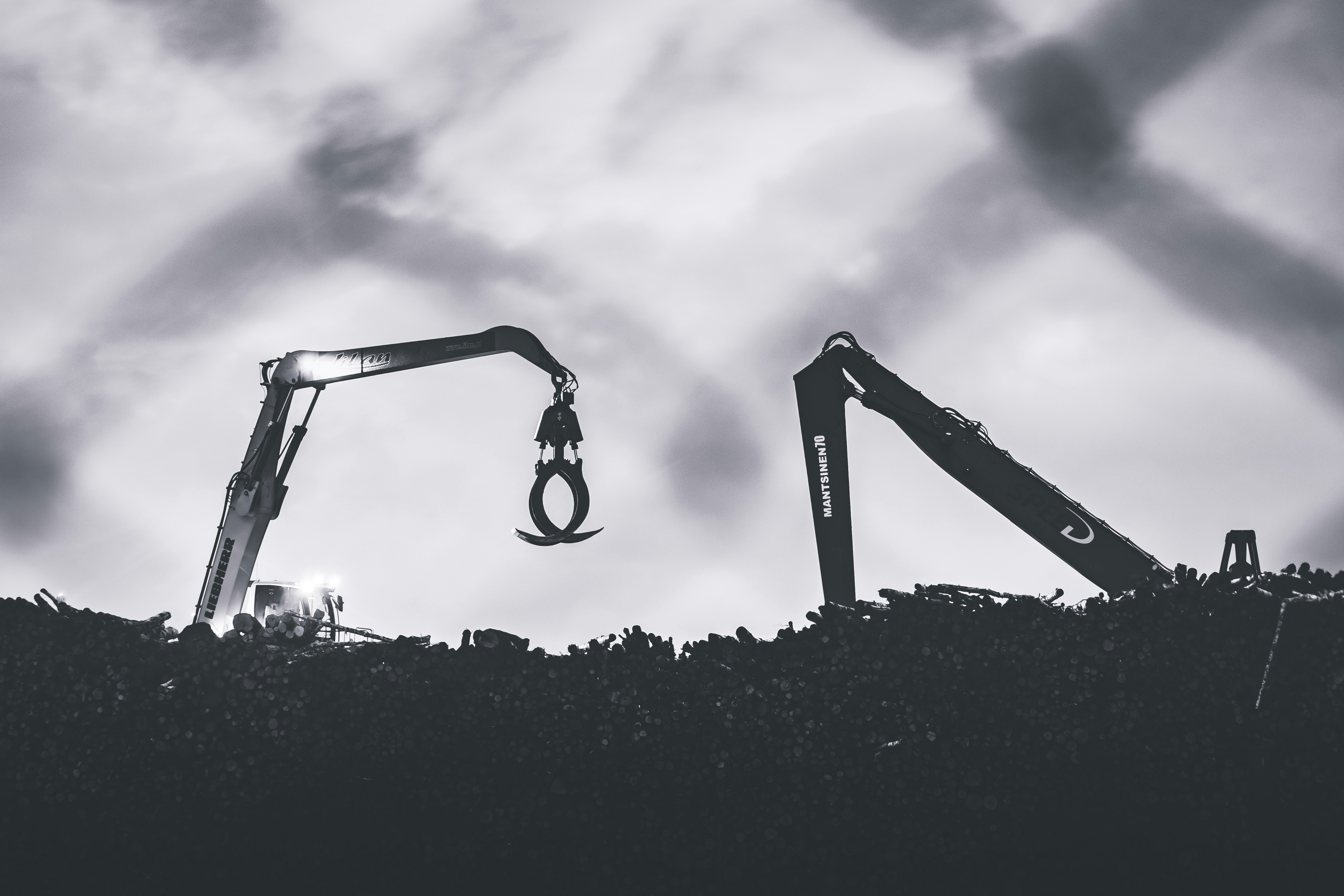 silhouette of man standing on a ladder